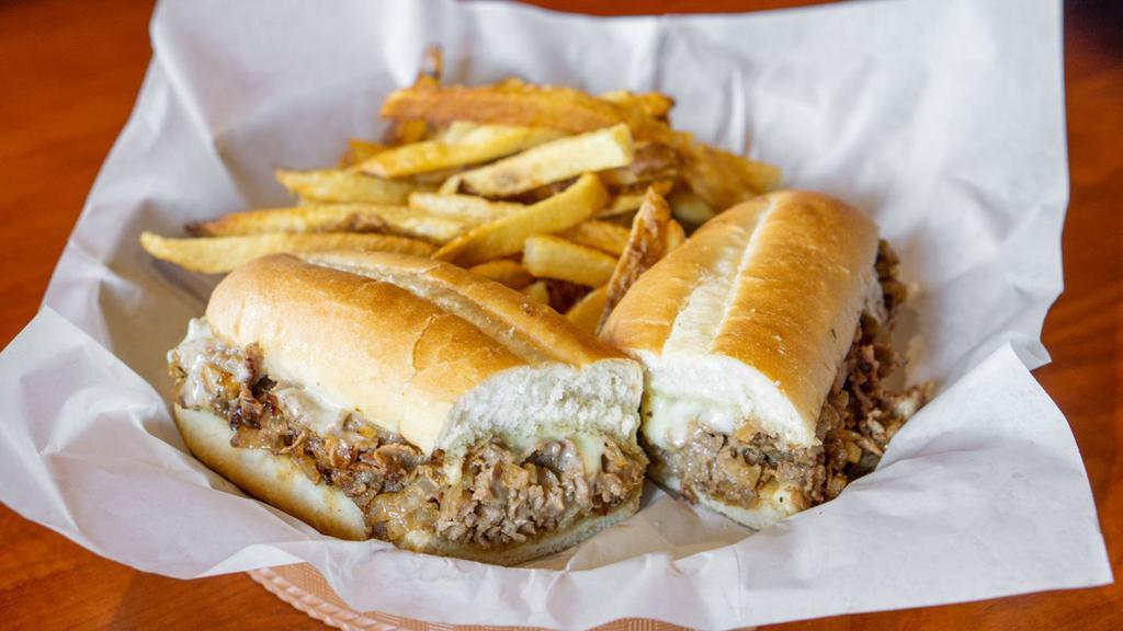 Philly Cheesesteak Sandwich · Thinly sliced seasoned steak grilled and topped with grilled onions and melted cheese, served on a fresh baked French roll.