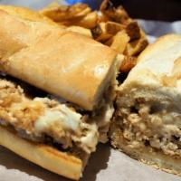 Chicken Philly Sandwich · Thinly sliced chicken and grilled onions smothered in melted cheese on a fresh baked French ...