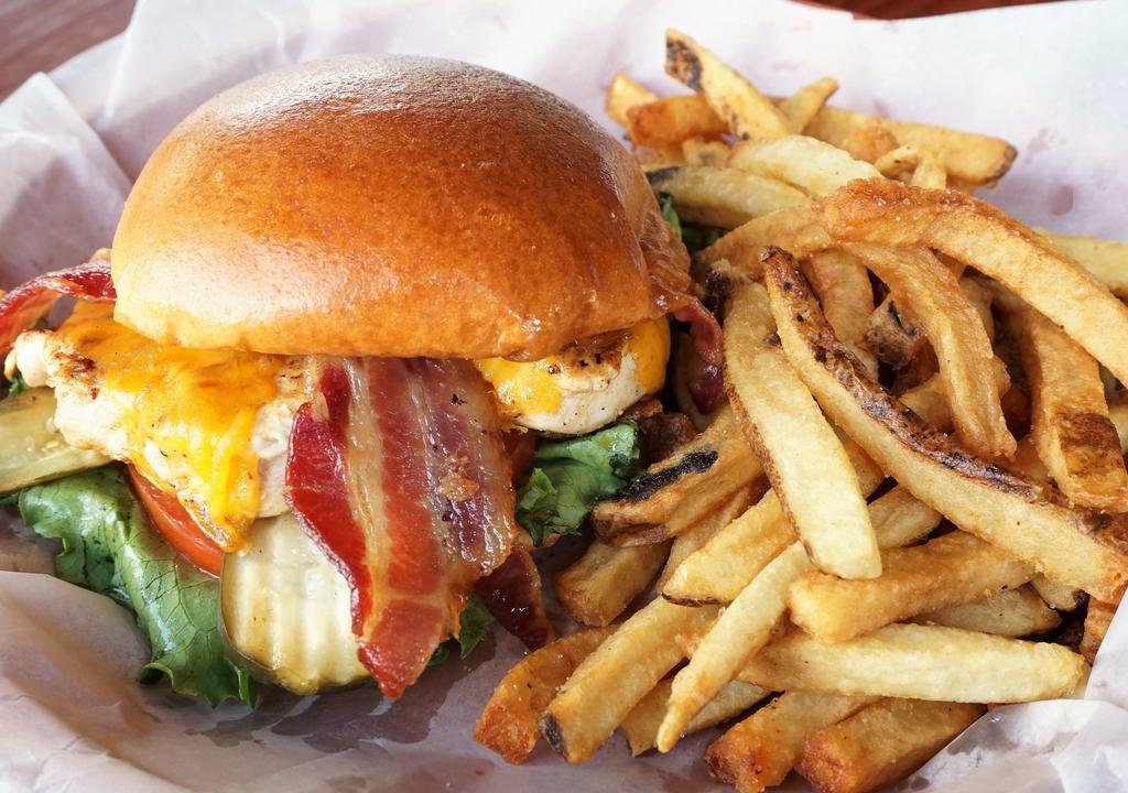 Cheddar Chicken Sandwich · A fresh chicken breast marinated, grilled and topped with mayonnaise, lettuce, tomato, cheddar cheese, and bacon on a brioche bun.
