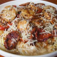 New Orleans Pasta · Cajun grilled chicken, shrimp, andouille sausage, roasted red peppers and onions served over...