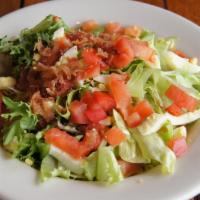 Garden Salad · Fresh mixed greens topped with diced tomatoes, eggs and bacon. Served with your dressing of ...