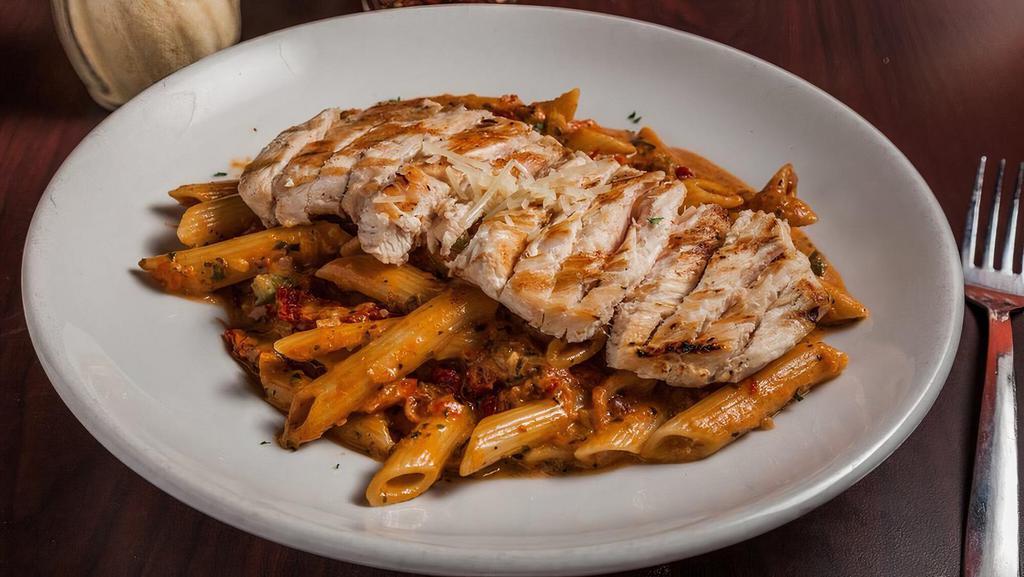 Chicken Pomodoro · Grilled chicken breast served over penne pasta and our creamy marinara sauce, sundried tomatoes and house made fresh basil.