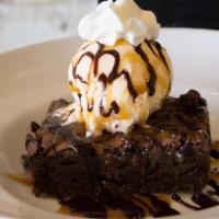 Brownie A La Mode · Warm, fudgy brownie topped with vanilla ice cream, chocolate, and caramel sauce and whipped ...