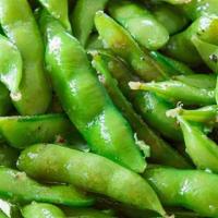 Edamame · Steamed Soybeans in pods dashed with Salt. Vegetarian, vegan, gluten-free, and soy-free.