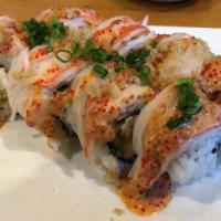 Pink Volcano Roll · shrimp tempura, cucumber, and cream cheese topped with crab, volcano sauce, tempura flakes, ...