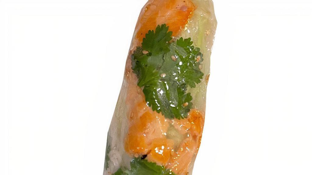 Caramelized Salmon · Freshly wrapped rice paper rolls filled with rice noodles, caramelized salmon, pickled carrots & daikon, cilantro, cucumber, crispy roll, sesame seeds, and fresh herbs. Served with peanut hoisin sauce.
