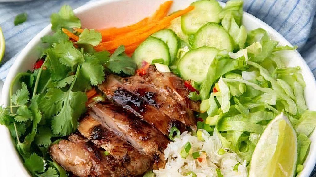 Rice Bowl · Jasmine rice, mixed greens, cherry tomatoes, pickled daikon & carrot, sliced cucumber, crispy shallots, & house sauce. Served with side of vegan soup.