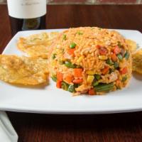 Arroz Con Pollo · A mix of chicken rice & veggie with french fries.