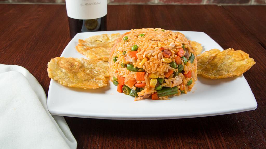 Arroz Con Pollo · A mix of chicken rice & veggie with french fries.