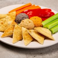 Hummus Trio W/ Wood Fired Pita Chips · traditional, roasted red pepper, and black bean hummus, served with toasted pita points, car...