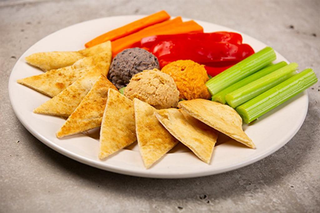 Hummus Trio W/ Wood Fired Pita Chips · traditional, roasted red pepper, and black bean hummus, served with toasted pita points, carrots, celery and red peppers.
