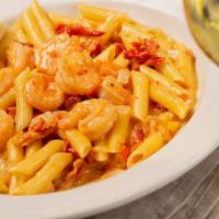 Shrimp Carbonara · sautéed shrimp, crumbled bacon, red onions and sun-dried tomatoes tossed with alfredo sauce ...