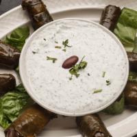 Stuffed Grape Leaves · The famous dolmas stuffed with rice and served with tzatziki sauce.