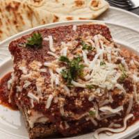 Lasagna A Forno With Small Caesar Salad & Pita Bread · Layers of fresh lasagna pasta filled with imported cheese and ground veal and topped with ou...