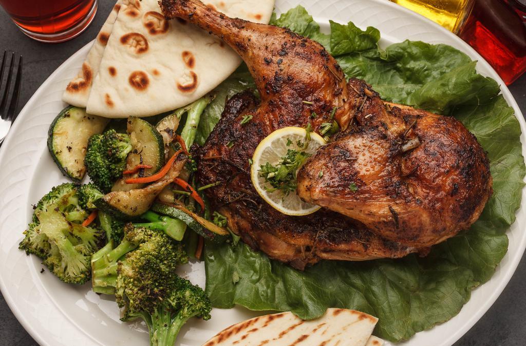 Roasted Chicken With Small Caesar Salad & Pita Bread · Marinated with a tantalizing blend of Mediterranean spices and slow roasted to perfection and with choice of side.