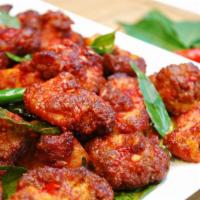 Chicken 65 · Delicious fried chicken bites with ginger, garlic, chilly paste.