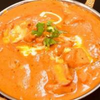 Butter Chicken · A smooth dish of marinated chicken breast pieces cooked in creamy tomato sauce.