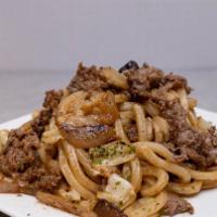 Pan Fried Udon · Stir-fried udon noddles with cabbage, onions and sliced shiitake mushrooms in our sweet and ...