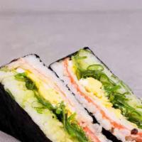 Japanese Rice Ball · filled with seaweed salad, imitated crab meat, and a sliced boiled egg, with our sweet Japan...