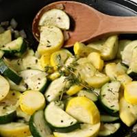 Squash & Zucchini · Squash and zucchini sauteed with onions and veggie seasoning.