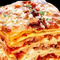 Lasagna · Italian dish made of stacked layers of thin flat pasta alternating with fillings. layered di...