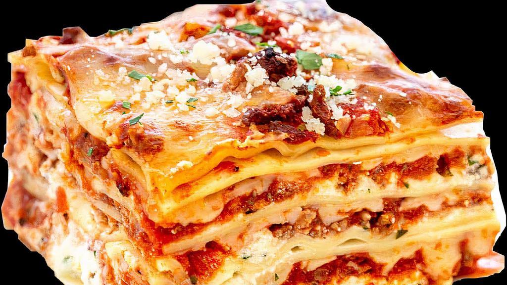 Lasagna · Italian dish made of stacked layers of thin flat pasta alternating with fillings. layered dish with wide flat pasta.