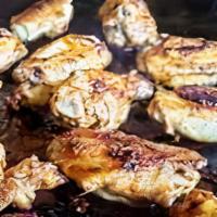 Blackstone Wings · Chicken wings smoked to perfection on our blackstone grill topped off with our homemade glaz...