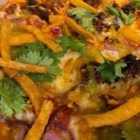 Mexican Street Pizza · Red Sauce, Cheddar, Mozzarella, Red Onion, Jalapenos, Chicken, Chorizo, Avocado Crema, Cilan...