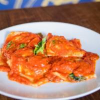 Ravioli Classico · Homemade ravioli stuffed with ricotta and spinach, butter sage or tomato sauce