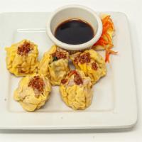 5 Pieces Steamed Dumplings · Chicken and shrimp with shiitake mushrooms and onion, topped with crunchy garlic and served ...