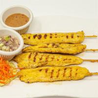4 Satay Gai · Grilled marinated chicken on bamboo skewer, served with peanut dipping sauce and cucumber sw...