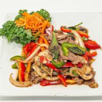 Pad Ka Prao (Basil) · Sauteed crushed garlic and chili pepper with onions, mushrooms and bell peppers. This authen...