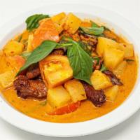 Duck Curry · Mild. Crispy duck sauteed in red curry with pineapples and tomatoes. Served with our house s...