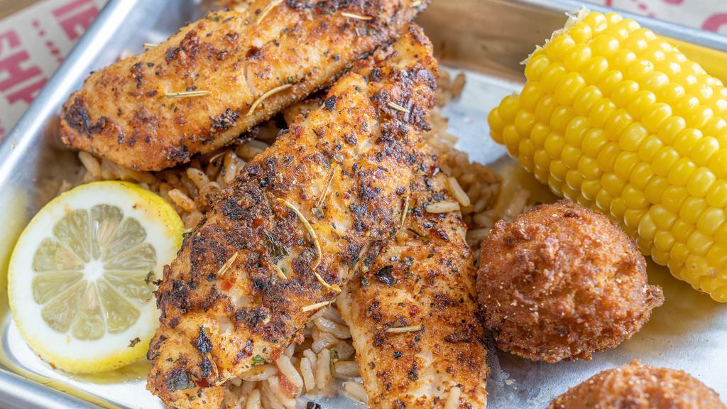 Blackened Catfish Dinner · Fresh catfish seasoned with our house blackened spices and seared on the grill. Served with 3 pcs of grilled catfish plated best on a bed of Cajun rice, corn on the cob, and 2 hushpuppies. Side substitutions are available, choose any 2!
