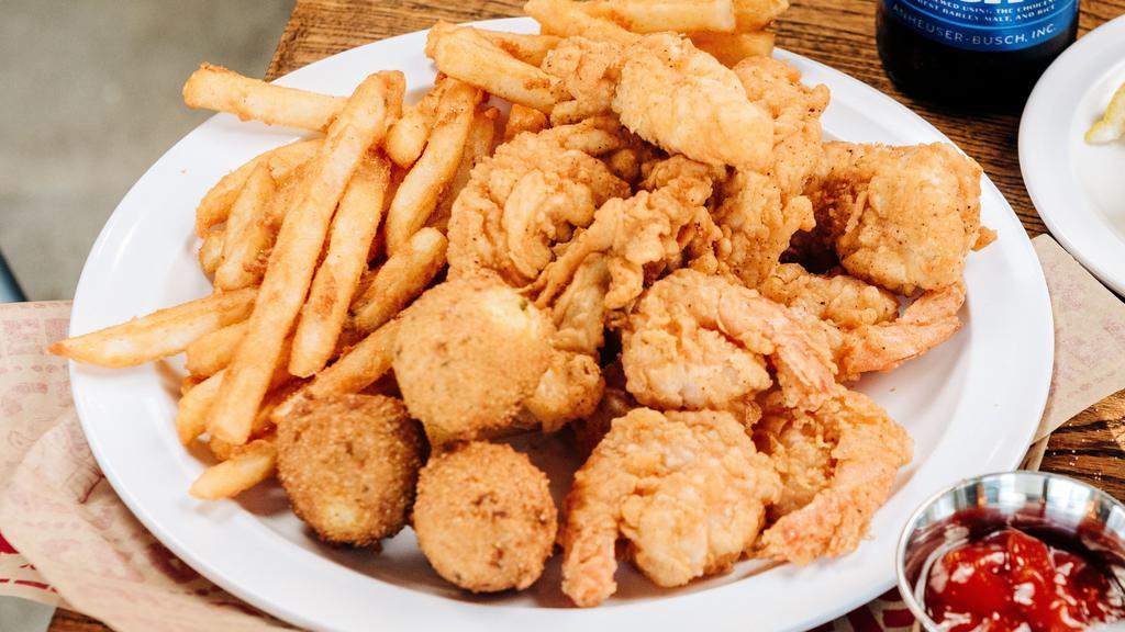 Chicken & Shrimp Combo · Two pieces fresh, free-range Arkansas chicken tenders, and six of our hand-breaded shrimp fried to crisp perfection, served with two regular sides and hush-puppies.
