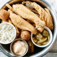 Catfish Dinner · Served with two regular sides and hush-puppies.