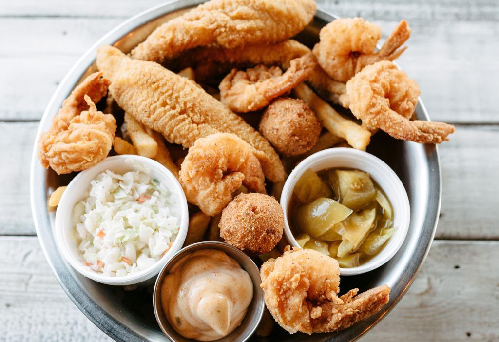 Catfish & Shrimp Dinner · Two pieces U.S. farm-raised catfish and six of our hand-breaded shrimp fried to crisp perfection, served with two regular sides and hush-puppies.