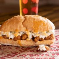 Crawfish Po’Boy · Quarter pound battered crawfish tails served on toasted new Orleans style french bread, topp...