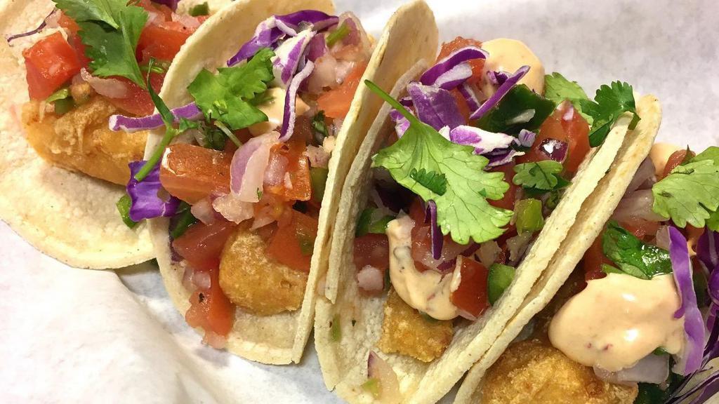 Vegan Baja Fish Tacos · 2 vegan fish tacos served on choice of tortilla, topped with pico, lettuce, cabbage and our famous vegan made baja sauce. Served with chips and salsa.