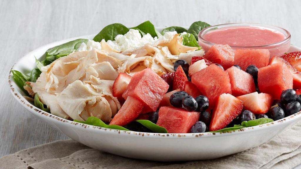 New - Red, White And Blueberry Salad (P) · All-natural chicken, fresh spinach, feta, strawberries, blueberries and watermelon. Served with raspberry vinaigrette. (Dressing adds 220 cal)
