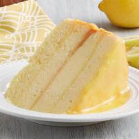 Lemon Cake Slice · Fluffy cake layered with a sweet and tart iced lemon glaze.