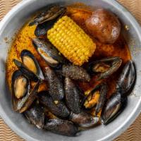 1/2 Lb Black Mussel · Served with corn and potato.
