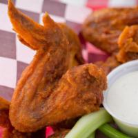 Buffalo Wings (Whole) · Six whole wings tossed in our buffalo sauce served with celery and your choice of ranch or b...