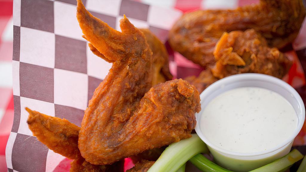 Buffalo Wings (Whole) · Six whole wings tossed in our buffalo sauce served with celery and your choice of ranch or blue cheese