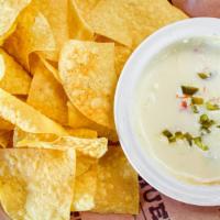 Huey’S Queso Dip · With tomatoes and jalapenos.