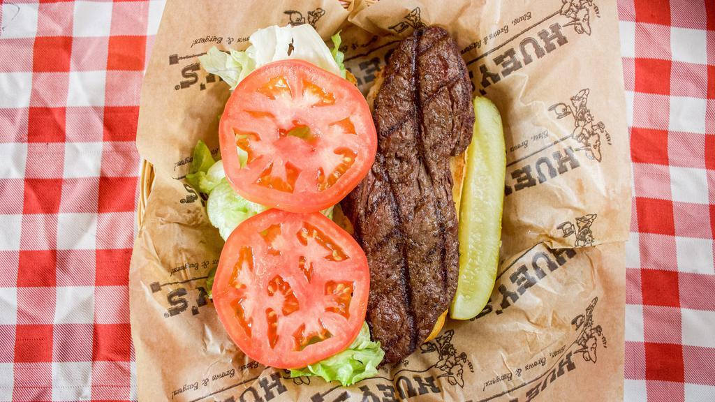 Steak Sandwich (7 Oz.) · Tenderloin filet, seasoned, and served open face with lettuce, and tomato on a buttered, toasted hoagie roll.