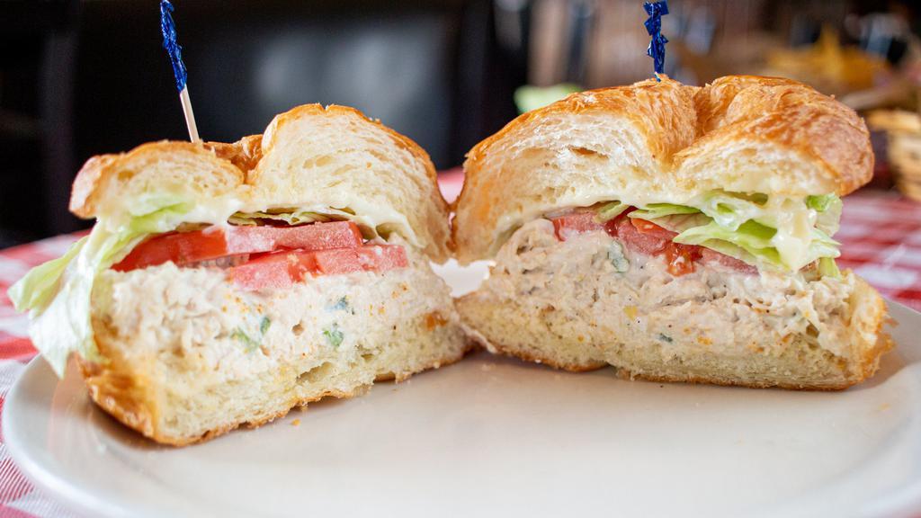 Chicken Salad Sandwich · Our homemade chicken salad served on a croissant or wheat bread with lettuce and tomato.