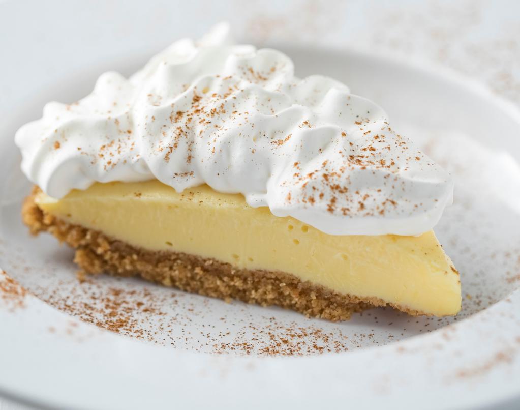 Homemade Lemon Ice Box Pie · Topped with whipped cream.