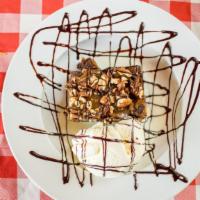 The Rock Slide · Melt in your mouth brownie topped with luscious caramel, brownie cubes, toasted pecans, and ...