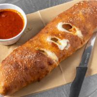 Stromboli - Buffalo Chicken · Chicken, mild sauce, bacon, fried onions, with ranch or blue cheese